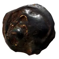 Potin with diabolical head and wolf