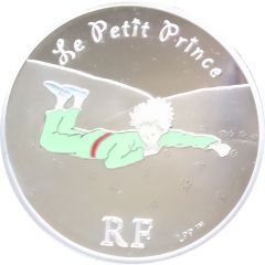 1 1/2 Euro The Little Prince laid down in the grass